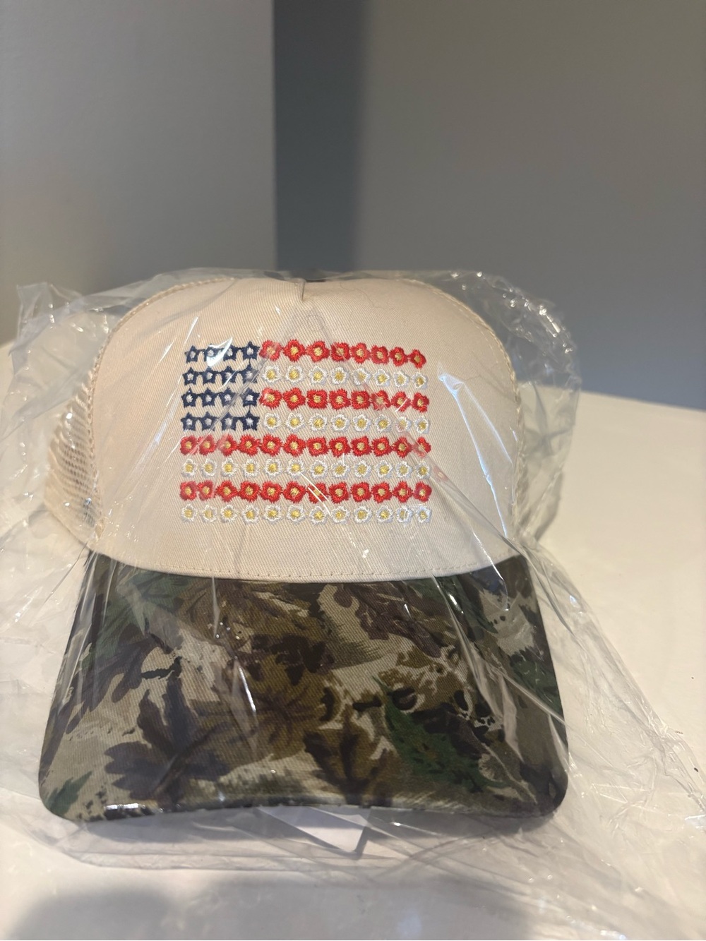 Beige Trucker Hat with Embroidered Floral American Flag and Camo Brim